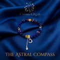 The Sagittarius crystal bracelet resting on a dark blue satin background. The multi-colored beads and the silver moon-and-star pendant are clearly visible. The text “THE ASTRAL COMPASS” in gold font is below the bracelet, with the CosmicGlyph logo above, creating an elegant and mystical product presentation.